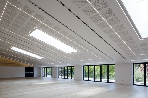 Vaulted ceiling commerical space with designed lighting and acoutics